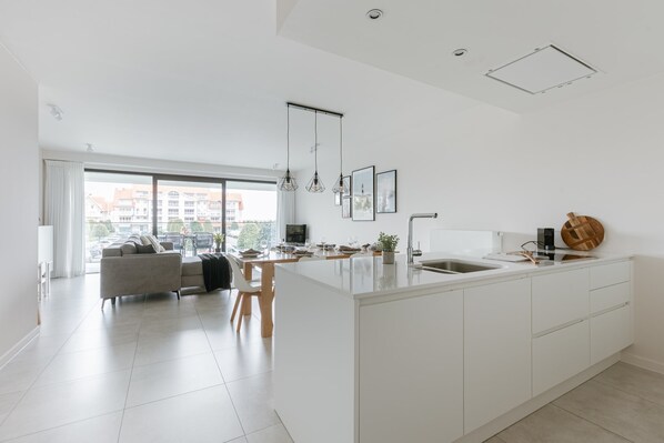 Modern, spacious living room with a lot of natural light