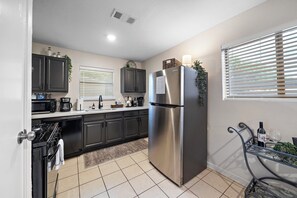 Black, bold, and beautiful—our kitchen packs a punch with its sleek design!