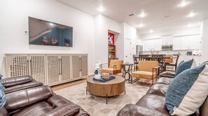 Bright, open living and dining area designed for comfort and connection, just a walk away from AT&T Stadium and Globe Life Field.
