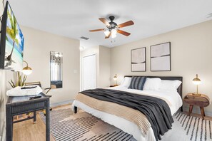 Relax in our cozy bedroom with premium linens perfect for unwinding after a day of city adventures.