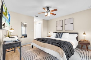 Relax in our cozy bedroom with premium linens perfect for unwinding after a day of city adventures.
