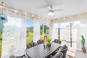 Our charming, screened lanai (a.k.a. Florida room) allows you to dine and gather with friends and family while basking in the warmth of the sun and enjoying indoor comfort.