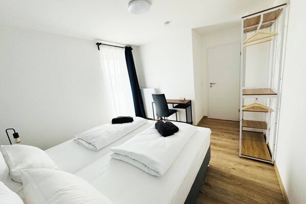 Cozy bedroom featuring comfortable beds, perfect for a restful night's sleep