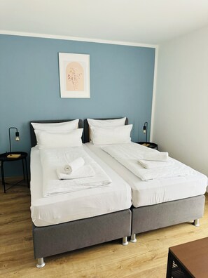 Securely joined single beds provide a stable and cozy sleeping arrangement