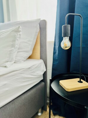 Cozy bedside lamp on a night stand, perfect for reading or relaxing
