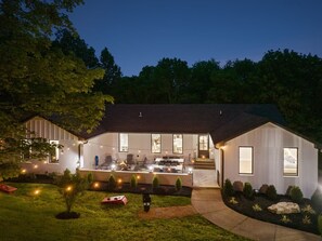 Nightime exterior with string lights creating the perfect ambience