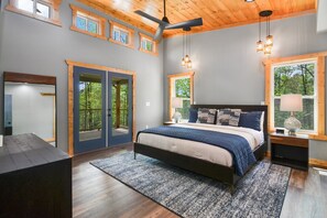 French doors access the patio from the primary bedroom