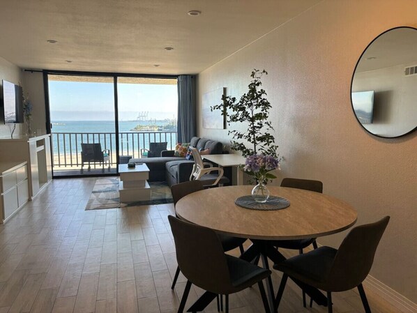 Living room open concept to dining and kitchen areas