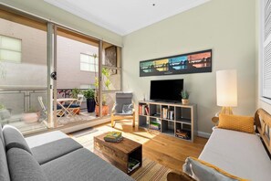  The living room is bathed in natural light from the adjoining balcony that brings in warmth and a fresh breeze

