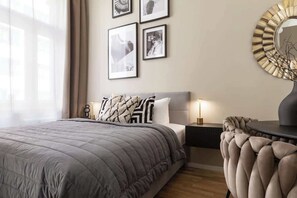 Living area with a bed, sofa bed and kitchen