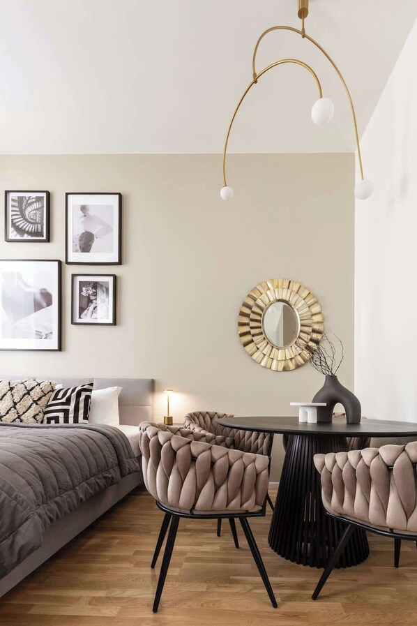 Living area with a bed, sofa bed and kitchen