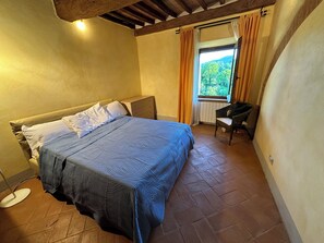 BEDROOM with stunning view of vineyards, orchards and Mount Cetona