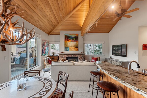 6 person dining table and 3 stools at granite counter
