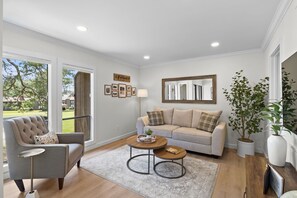 ~Relax in style with panoramic views of the golf course from this spacious and inviting living room sanctuary~