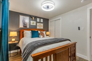 Cozy bedroom with plush beddings and queen bed