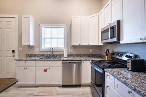 Cook your favorite meals in our fully furnished Kitchen with Oven, Stove, Microwave, Refrigerator, Freezer, Keurig Coffee, in Biloxi, MS. A short walk from Biloxi Beach Board Walk, the Beau Rivage Casino, the Hard Rock Casino, and MGM Baseball Park.
