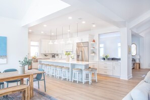This exquisite beachfront home offers private beach access, breathtaking views, a heated pool & spa, and a chef's kitchen.