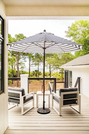 This exquisite beachfront home offers private beach access, breathtaking views, a heated pool & spa, and a chef's kitchen.