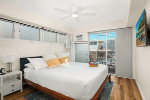 Relax in the master bedroom with a king-size bed, AC, 43'' smart TV, and a private lanai.