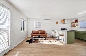 Living Room with plenty of space to lounge and hang out with friends and family.