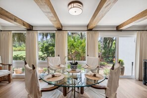 Dining room area w/ a wall of windows to let in the natural light - table will seat six.