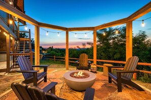 Enjoy the view by the fire on the swings or Adirondack chairs.