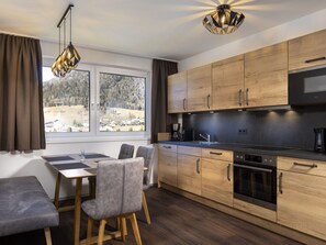 Property, Furniture, Cabinetry, Table, Countertop, Curtain, Wood, Interior Design, Lighting, Kitchen