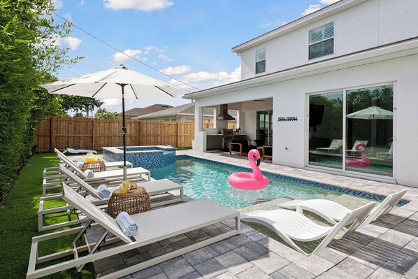 SouthFACING pool = longer sun days! Salt pool/spa and covered lanai w/ grill &TV