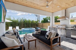 Perfect Lanai sun breaks with built in grill, fridge, and 2 couches with TV!