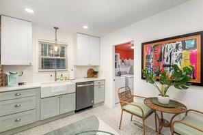 Spacious and bright kitchen with seating, perfect for enjoying your time while cooking – directly flows into the dining room