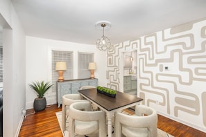 Enjoy your meals in this bright dining room, conveniently connected to both the living room and kitchen.