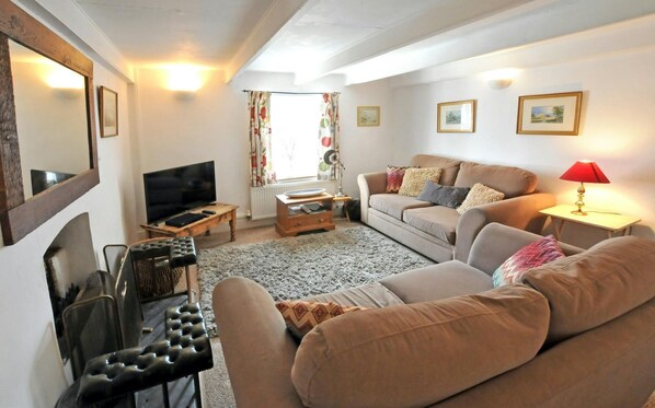 Living room with two sofas and TV