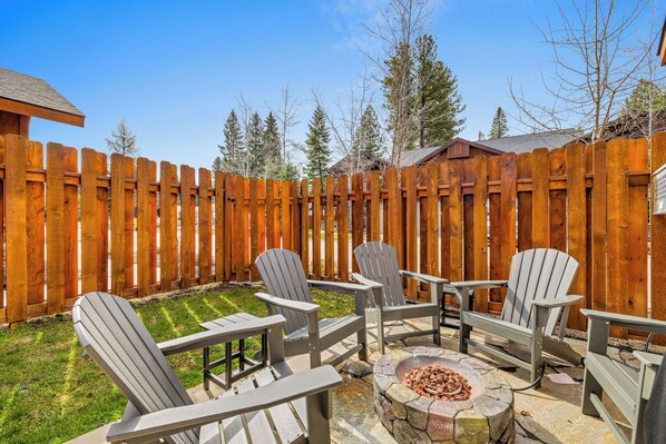Fire pit in the fenced back yard
