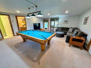 Lower level family room with Pool Table and TV
