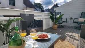 Sunny terrasse with outdoor furniture