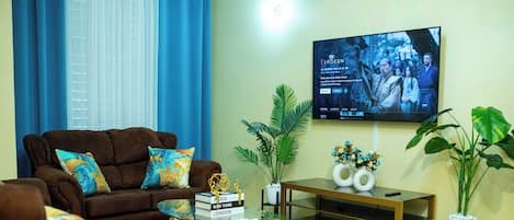 Our cozy living room features an A/C and a 55'' smart TV for entertainment