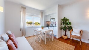 The kitchenette has the appliances needed for a vacation and also a dining table and a sofa
#livingarea #bright #kitchenette #algarve #portugal