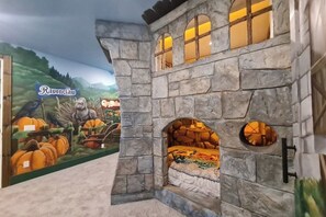 Your children will love the authentic style castle and our custom mural art featurng Hogwarts Houses