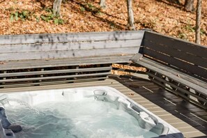 Relax in the hot tub off the main cabin