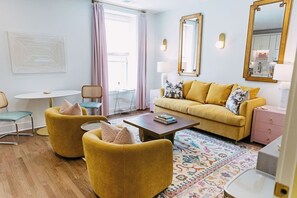 Spacious living room with Tempurpedic Sleeper Sofa, eat in kitchen, 75" TV. 