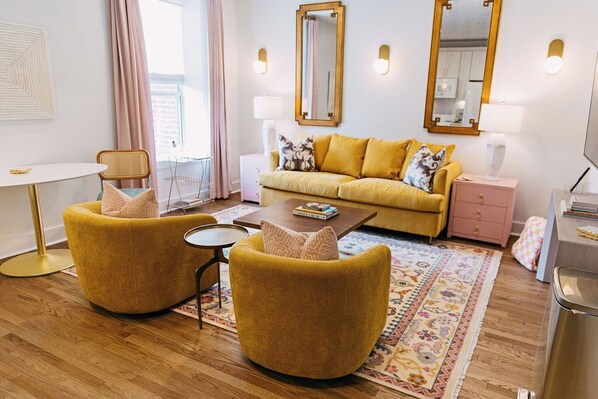 Spacious living room with Tempurpedic Sleeper Sofa, eat in kitchen, 75" TV. 