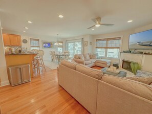 Tastefully updated open living area with 65" smart tv. 