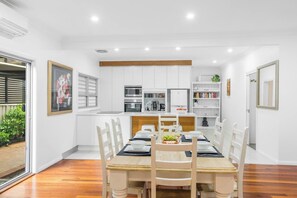 The dining table sits beside the outdoor entrance which conveniently provides a refreshing breeze with your meal or perhaps enjoy setting your desired temperature on the air-conditioning unit. 
