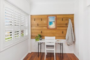 A dedicated office by the home entrance is the ideal space for remote workers.