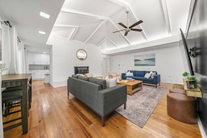 Cottage A- Easily sits up to 17 guests, to watch a movie on the 75” TV.