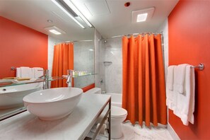 Modern bathroom with contemporary fixtures and vibrant accents, designed for a refreshing start to the day.