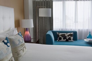 Bright and airy bedroom setup with comfortable bedding and inviting decor, designed for a restful experience.