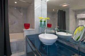 Stylish bathroom with modern fixtures and vibrant floral accents.