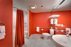 Eclectic and stylish bathroom, complete with striking fixtures and vibrant decor, ensuring a lively and refreshing environment.
