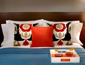 Bold and bright bedroom design, featuring eye-catching accents and a vibrant setting for an energized stay.